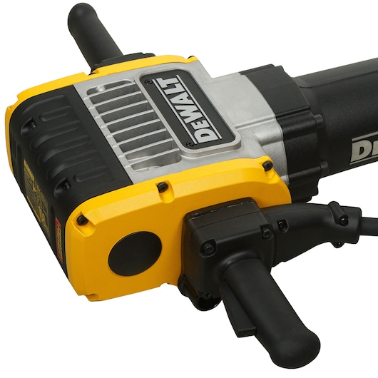 Close-up of a DEWALT electric demolition hammer with yellow and black handles and sturdy metal casing.
