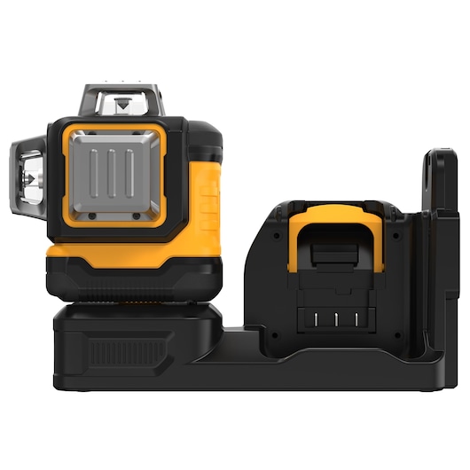 DEWALT yellow and black laser level with charger, shown from the side against a white background.