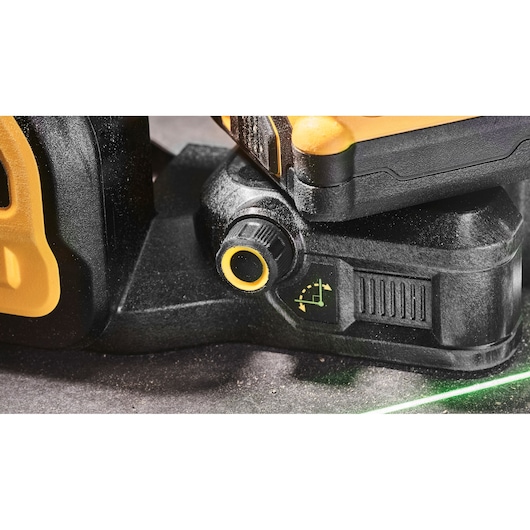 Close-up of DEWALT DCE089NG18 laser level showing its base and adjustment knob.