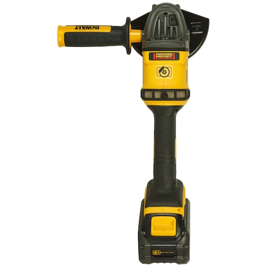Yellow and black DEWALT cordless angle grinder with side handle, photographed from the front.