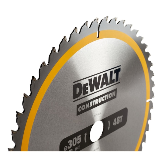 Close-up of a DEWALT DT1959 circular saw blade with sharp teeth and construction label.
