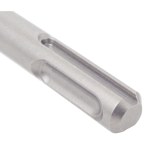 Close-up of a metallic cylindrical tool part with grooves, likely a drill bit shank.