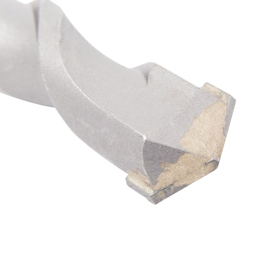 Close-up of a DEWALT masonry drill bit tip showing its cutting edges and durable metallic material.