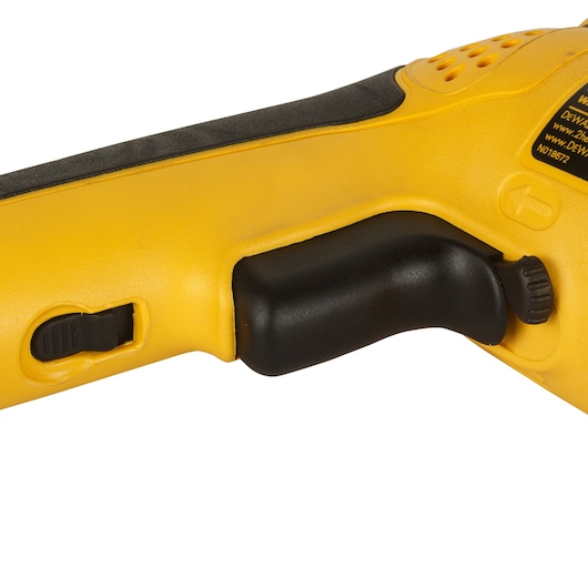Close-up of DEWALT DW269 tool handle in yellow and black, showing trigger and side switch.
