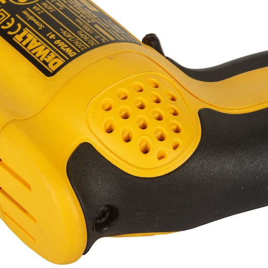 Close-up of a DEWALT DW269 yellow and black power tool with vented detail and product label visible.
