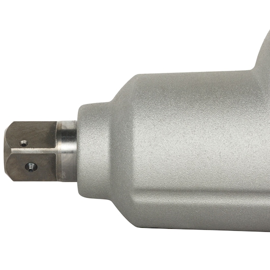 Close-up of the metallic head of a power tool, displaying a textured grey finish and industrial design.