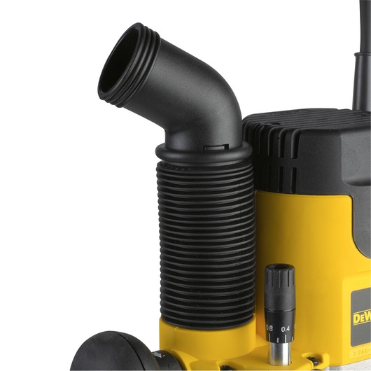 Close-up of a DEWALT DW622K photography tool showing a black ribbed hose attachment and part of the yellow body.