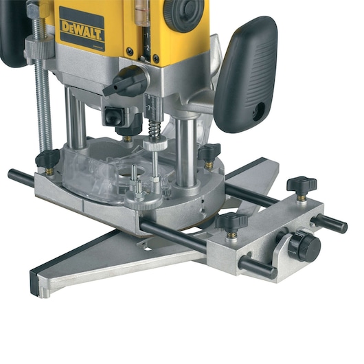 Close-up of a DEWALT plunge router with a metal base and adjustable guide rods, used for woodworking precision cuts.