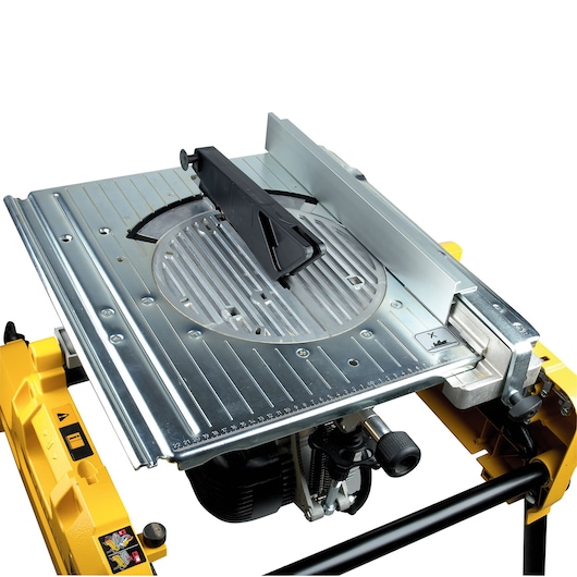 DEWALT DW743N table saw with metal surface and adjustable fence, shown in close-up view.