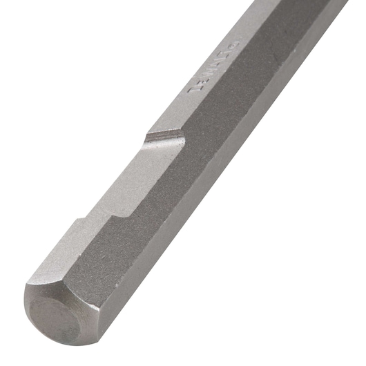 Close-up of a hexagonal DEWALT drill bit showing its metal surface and shaped end.