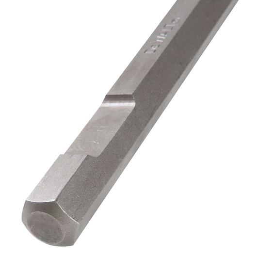 Close-up of a DEWALT hexagonal metal drill bit with etched branding, showing a flat and beveled edge.