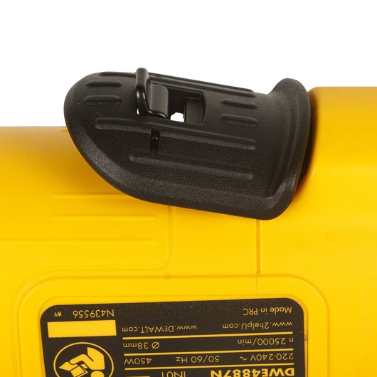 Close-up of a DEWALT yellow power tool with a black safety guard and model label DWE4887N visible.