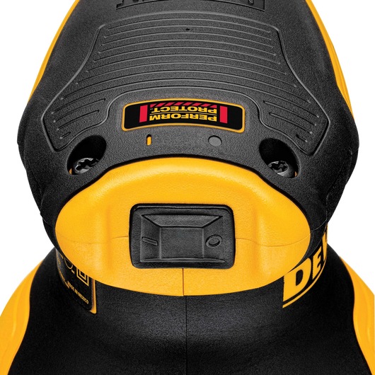 Close-up of a DEWALT DWE6423 power tool, showing its yellow and black body and the switch on the front.