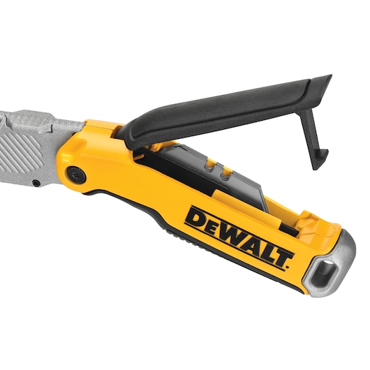 Close-up of DEWALT utility knife with yellow handle and black folding blade guard.