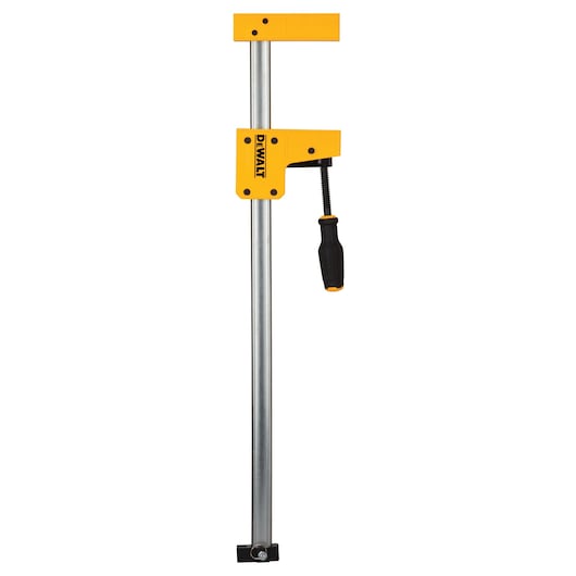 DEWALT bar clamp with yellow body and black handle, used for woodworking and material securing.