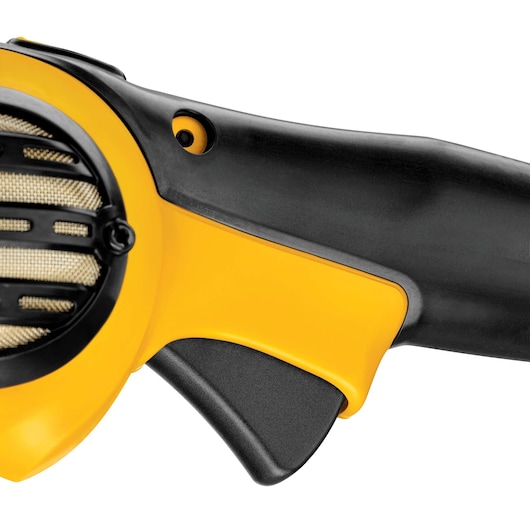 Close-up view of the handle and trigger of a DEWALT DWP849X power tool, showing yellow and black plastic components and part of a ventilation grille.