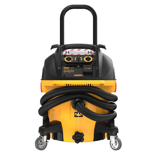 Front view of a DEWALT DWV905H industrial vacuum cleaner with a yellow and black body, large handle, wheels, control panel, and coiled hose attached.