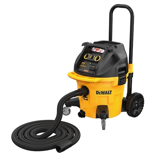 DEWALT mobile wet and dry vacuum cleaner with a yellow and black body, large wheels, handle, control panel, and a long flexible hose coiled on the ground.